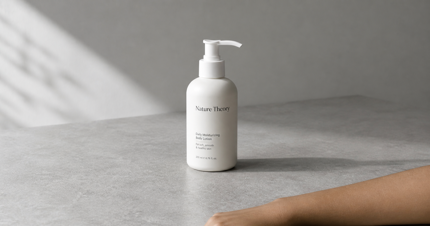 Matte white lotion bottle on grey stone surface representing panthenol skin hydration and barrier repair function in daily skincare